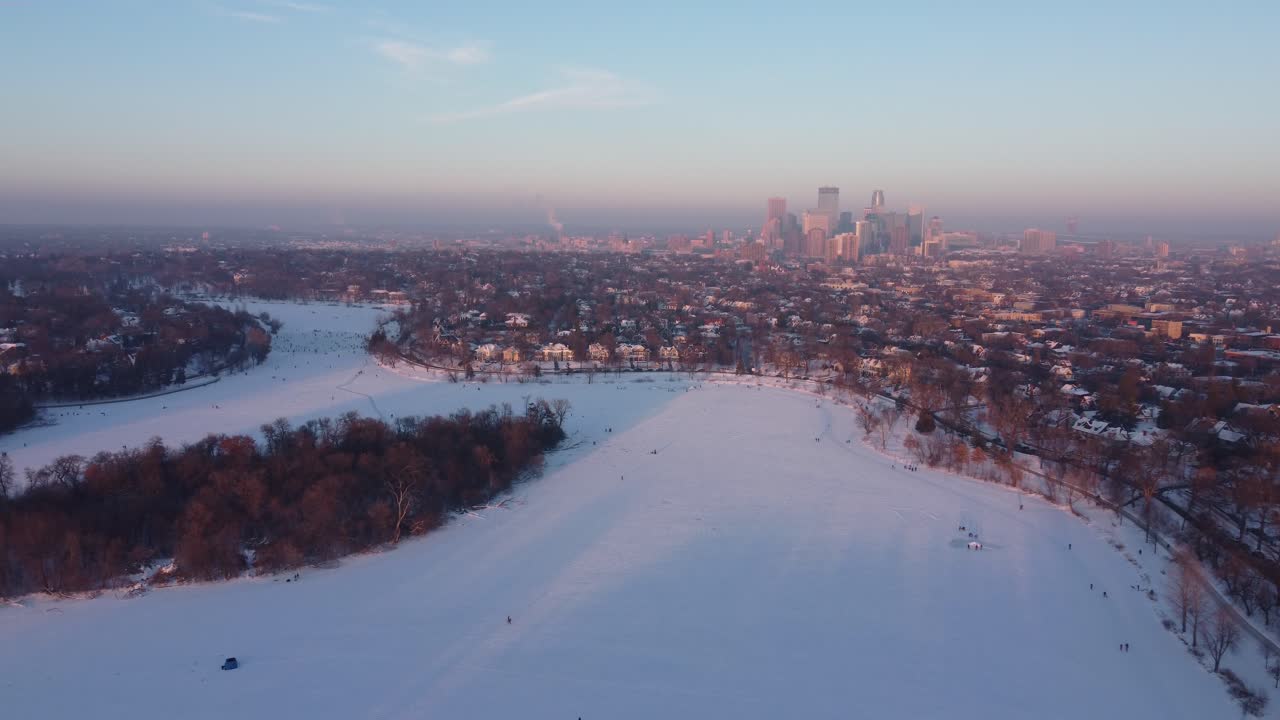 Sunset Drone Footage of Minneapolis, MN over Lake of the Isles in Winter