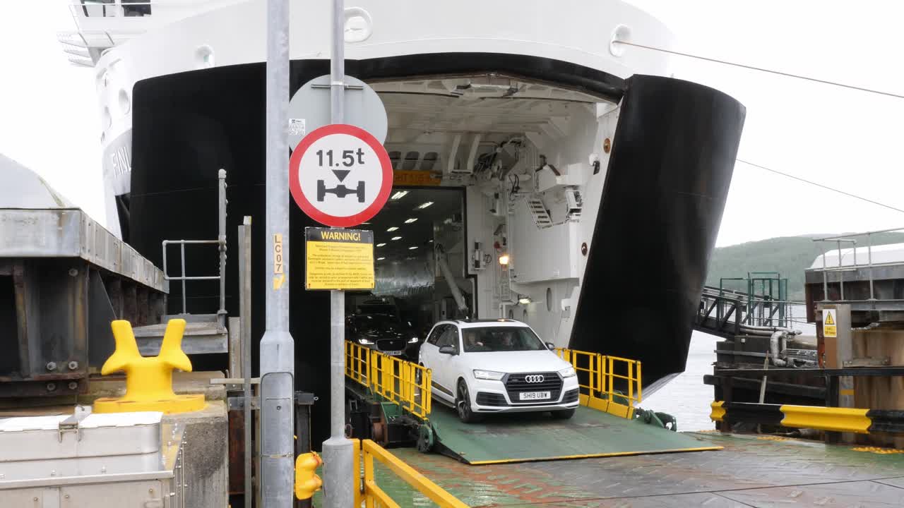 Cars coming off the Calmac car ferry Finlaggan at Kennacraig