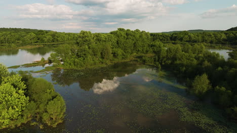 tranquil waters with reflection in lake sequoyah, ar, usa - aerial drone shot