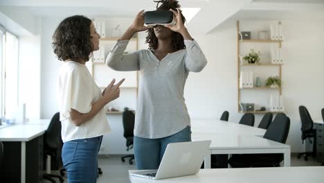 cheerful african american woman wearing virtual reality glasses.