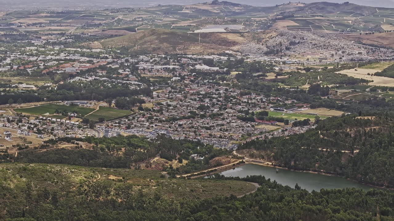 Stellenbosch South Africa Aerial v6 flyover hillside Tokara wine estate capturing Idasvallei dam, residential townscape, False bay and mountain landscape - Shot with Mavic 3 Pro Cine - Jan 6th 2024