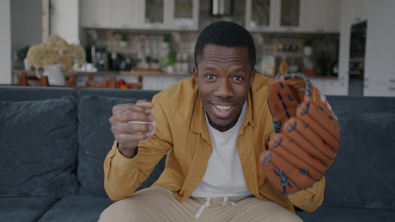 Man Watching Baseball Game at Home
