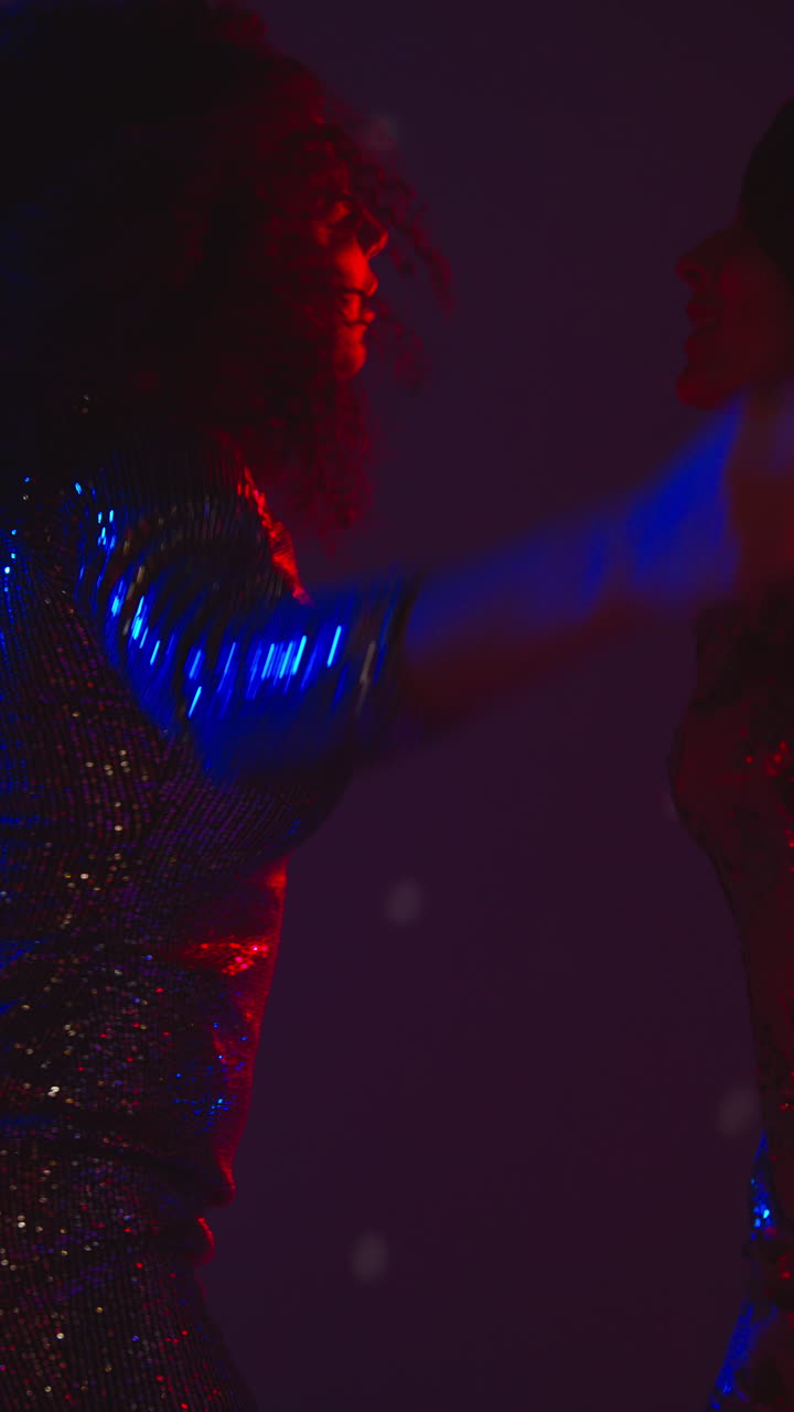 Vertical Video Of Two Women In Nightclub Bar Or Disco Dancing With Sparkling Lights In Background 2