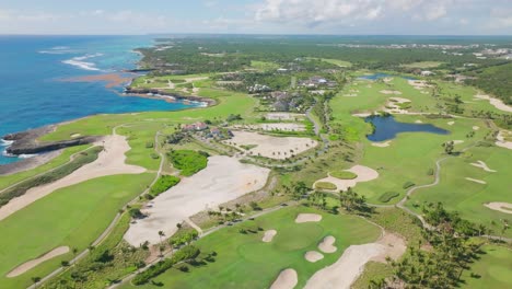 drone shot of los corales golf course with ocean views, dominican republic