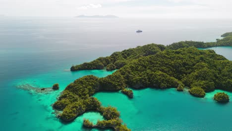 Aerial-drone-shot-of-Fiji's-Bay-of-Islands-with-shallow-coral-reef