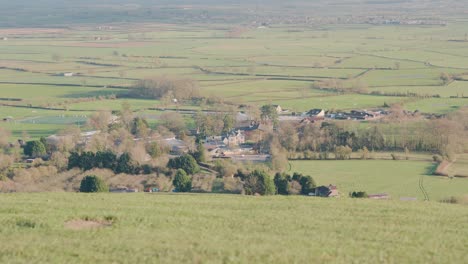 british countryside from glastonbury tor tower hill, view of small village, day