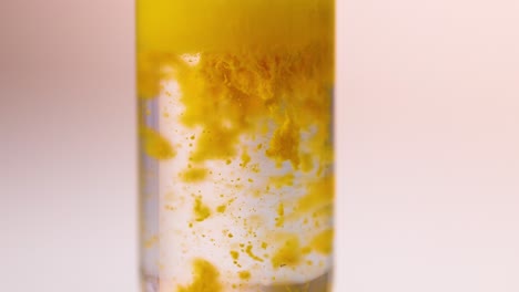 chemical reaction forming yellow precipitate in test tube