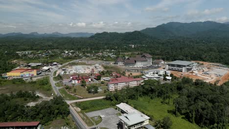 aerial drone view, serian district town ,summer with beautiful green trees,new building and water park lake, water from the mountain sarawak,borneo.