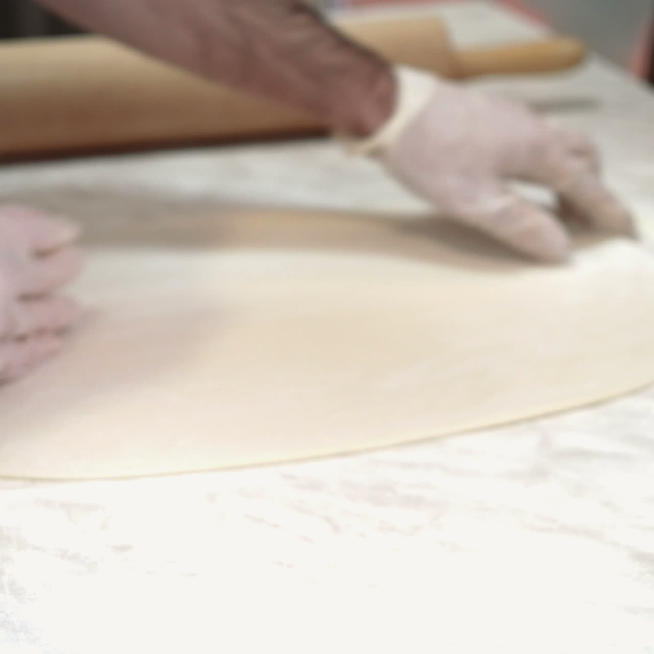 Pizza dough. Cook making delicious pizza at the restaurant, close-up Sqare video