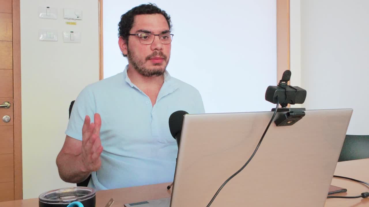 Discussing Strategy: Man on Team Video Call