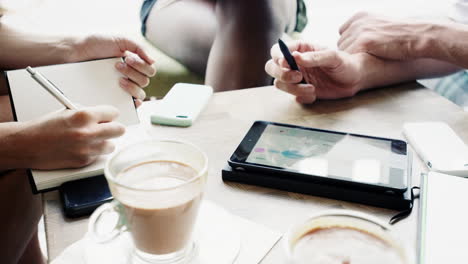 closeup hands business people meeting in cafe using digital tablet big data