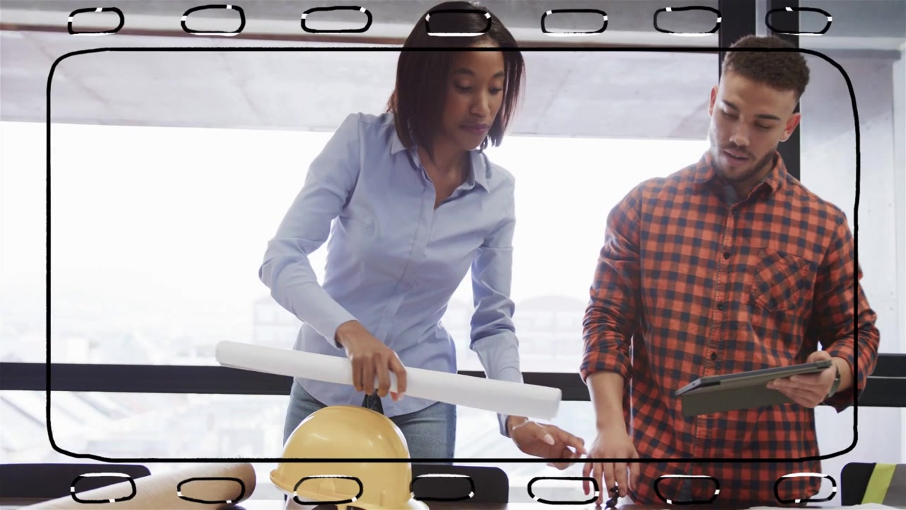 Woman unrolling plans while man tapping tablet and pointing at blueprint, coordinating engineering