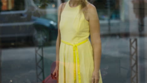 young girl passing by a shoe shop