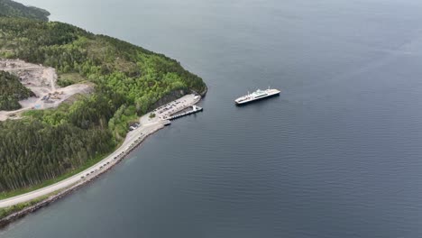 high angle aerial view of boreal ferry mf karlsoyfjord arriving at vestnes in norway