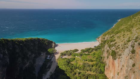 A-drone-view-over-an-Ireland,-making-an-incredible-view-with-green-water-of-the-sea-of-Albania