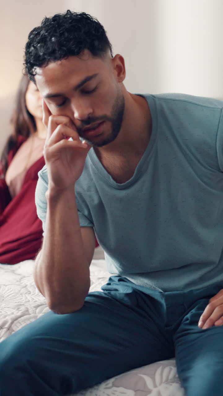 Young Couple Having a Serious Argument in Their Bedroom