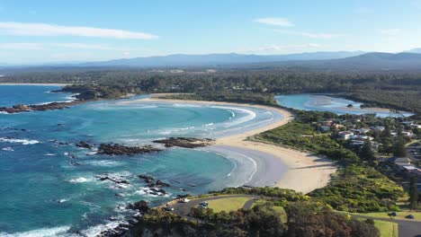 an excellent aerial view of waves lapping at the beaches of tomakin new south wales australia