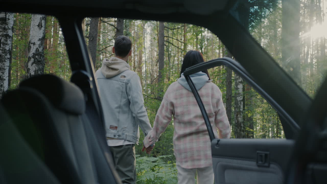Couple Exploring a Forest Path