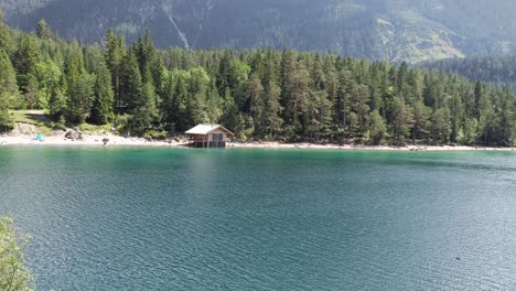 people swim in lake blindsee, beautiful lake in the mountains in tyrol austria