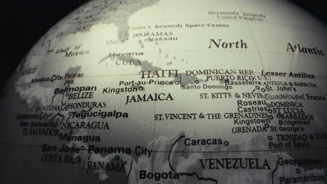 close-up view of a world globe focusing on the caribbean and central america
