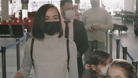 passengers in queue at check-in