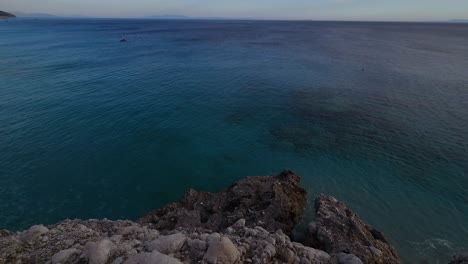 Vast-Deep-Blue-Sea-Stretches-Along-a-Rocky-Shoreline-in-a-Panoramic-Vista,-Inviting-Peaceful-Reflection-and-Serenity-in-Albania