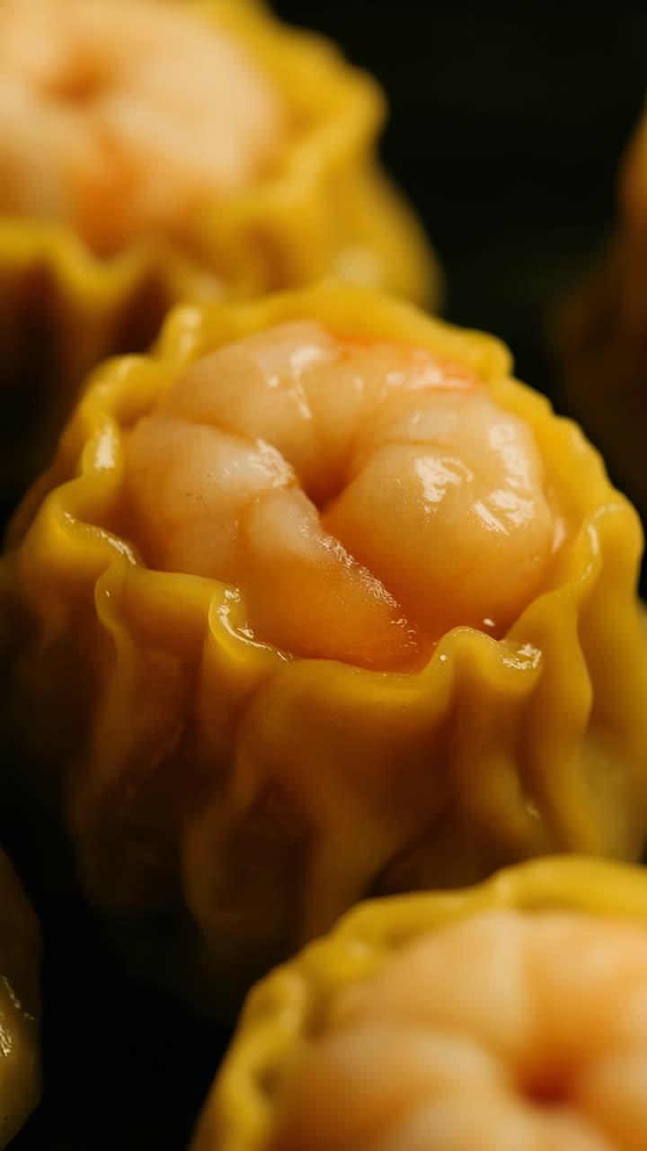 Close-up shot of delicious dim sum with shrimp filling, highlighting texture and color