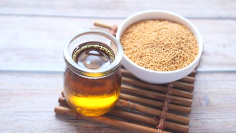 coking oil and seeds in a container on table