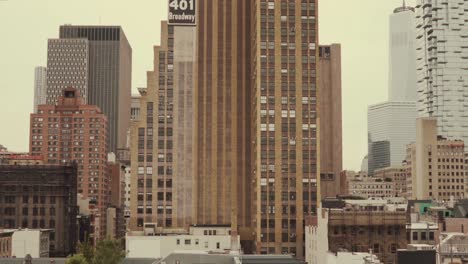 aerial moving shot of new york city with big buildings and skyscrapers. cityscape of urban city.