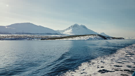 Wide-Static-Shot-of-Boat-Cruise-Sailing-along-the-Arctic-Fjords-in-Norway