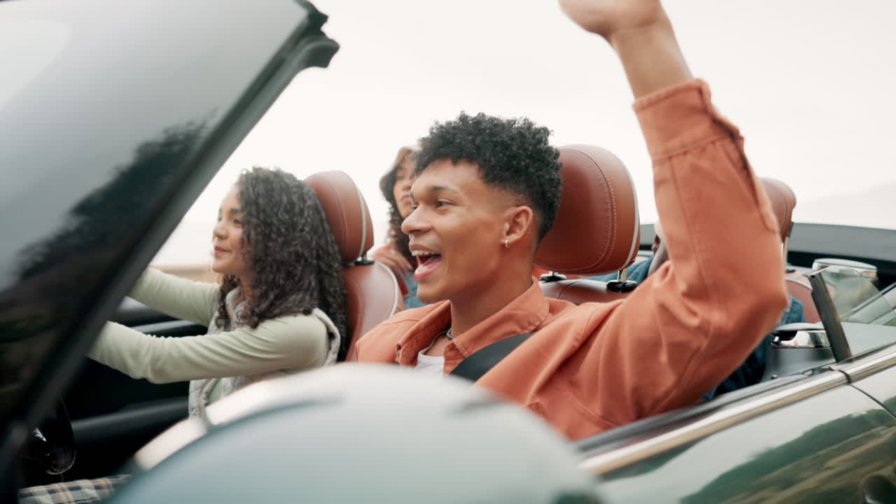 Group of friends on a road trip in a convertible