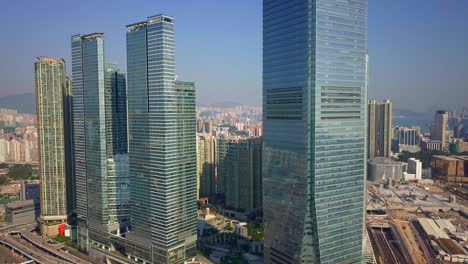 flyby aerial footage approaching icc, w hong kong and habourview place, elements in west kowloon, hong kong