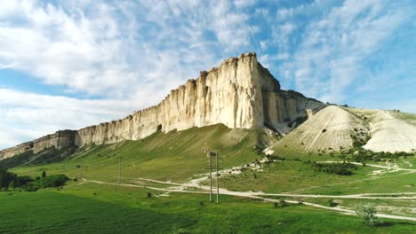 white cliffs and green valley landscape