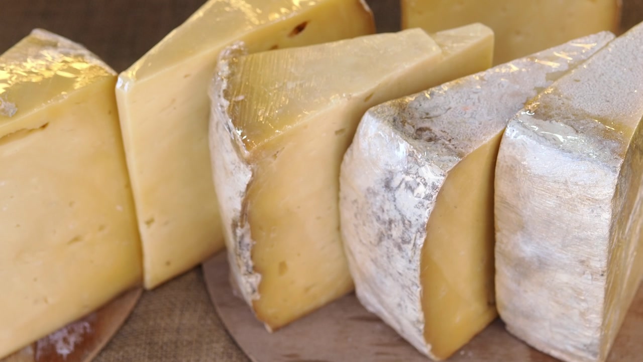 Close-up of Various Artisan Cheese Wedges on Display
