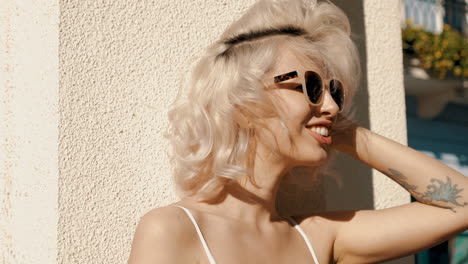 smiling woman in sunglasses outdoors