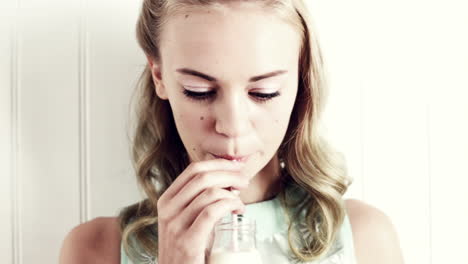 Pretty-girl-drinking-milk-with-straw