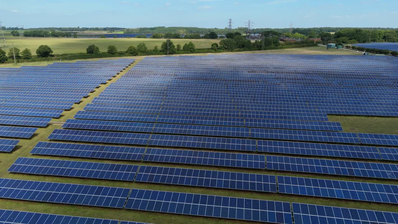 Overhead aerial footage of solar energy farm with panels producing renewable electricity England UK