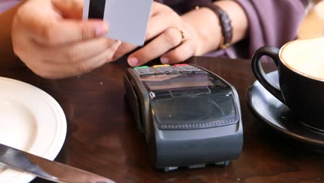 paying with credit card in a cafe