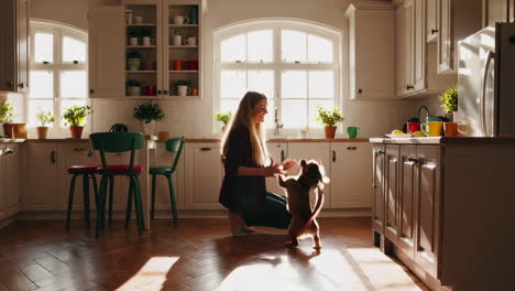 woman bonding with her dog in a bright kitchen