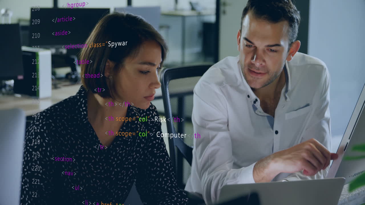 Colleagues discussing project over computer code animation in modern office