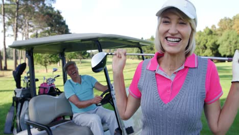 Female-golf-player-interacting-with-man