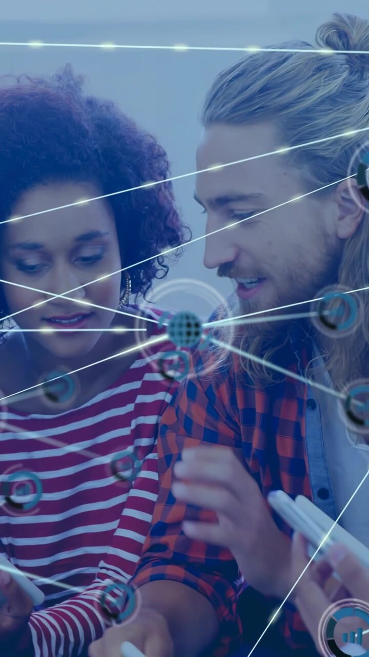Vertical video: Woman tapping tablet, overlay growing into network linking devices, sharing data