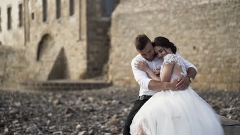 romantic wedding couple by ancient stone walls