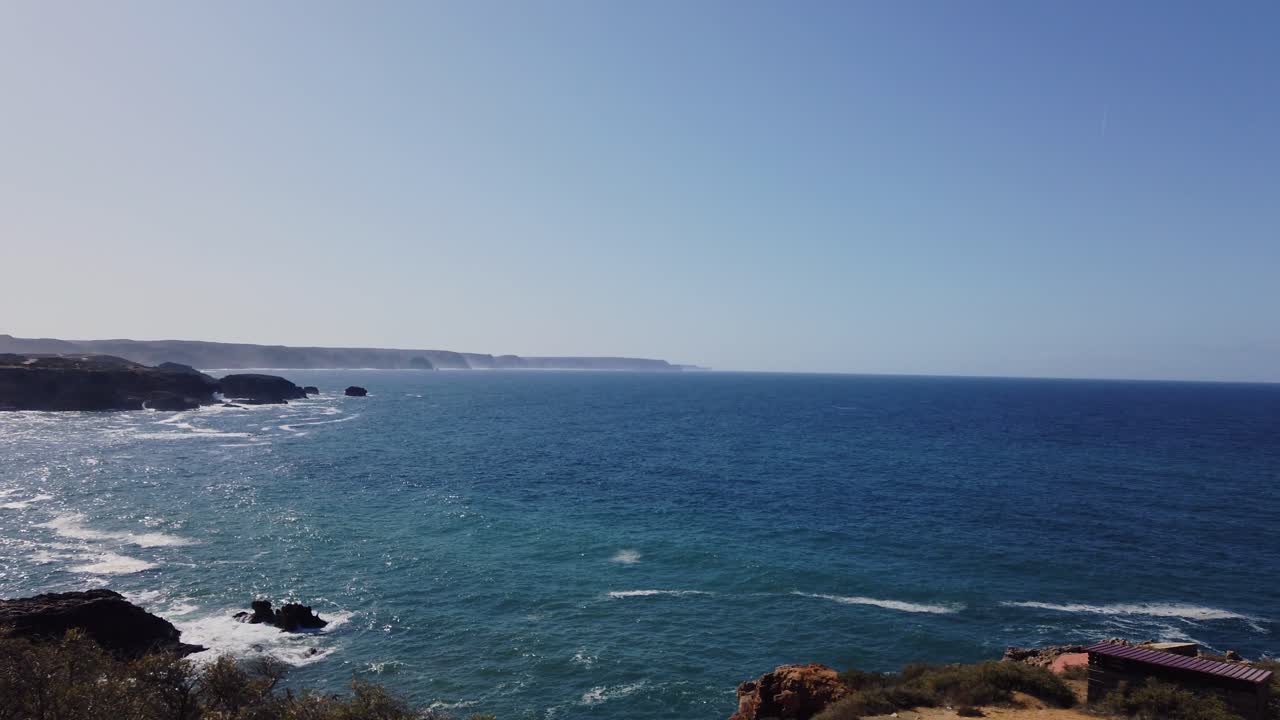 panning from the rock coast of the algarve in portugal heading to the atlantic ocean