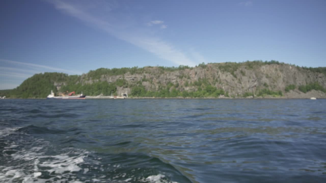 Summer speedboat trip through Norway fjords, slow motion panoramic