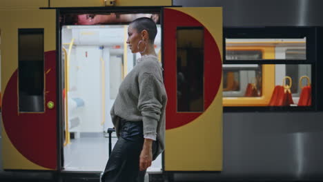 woman walking at a train station