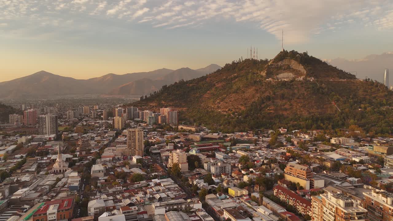 Aerial view of de Chile at sunset showing the Parque Metropolitano de , city's iconic urban park.