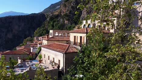 tranquil mediterranean retreat: hillside resort with infinity pool, veranda, sea view village, and exquisite stone architecture - pure relaxation