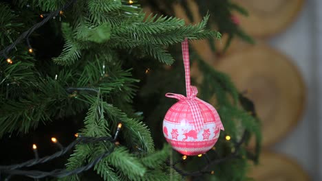 pink christmas ornament on a tree