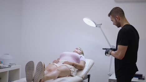 professional performing an eyelash or eyebrow treatment on a client